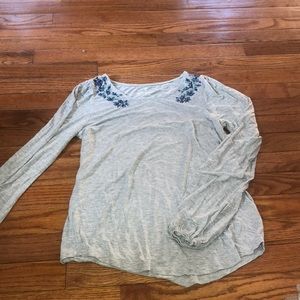 long sleeve grey shirt with flowers on shoulders